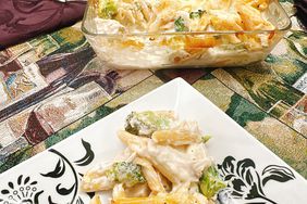 plated broccoli pasta with baking dish in background
