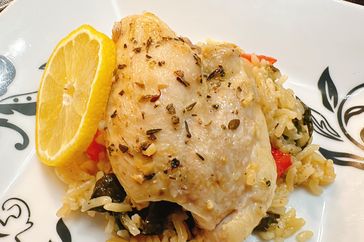 Garlic butter chicken thighs with lemon over rice