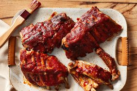 slow cooker baby back ribs served on a speckled platter 