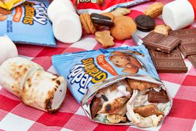 cookie snack bags with chocolate and toasted marshmallow 's'mores in a bag' on red checked tablecloth