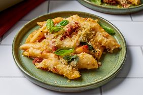 Marry Me Chicken Pasta Bake garnished with basil on green plates