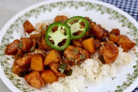 plate of peach jalapeno chicken over rice