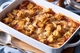 Close-up of golden, baked tomato soup and grilled cheese casserole served in a baking dish