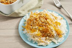 A plate of poppy seed chicken casserole served over white rice