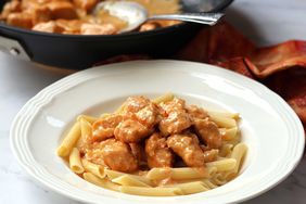 Garlic butter chicken bites on top of penne pasta