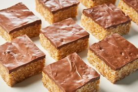 A view of chocolate-topped Scotcharoos on a surface