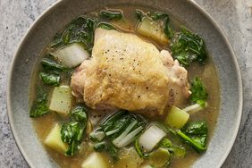 A bowl of chicken tinola with vegetables and broth
