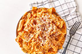 Lasagna sheet pasta with tomato sauce and cheese on plate