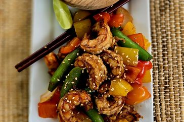 sesame shrimp on top of sauteed vegetables 