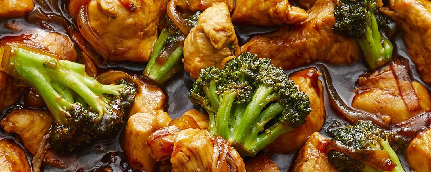 looking at a skillet of broccoli and chicken stir fry