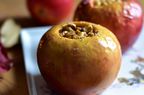 closeup of a baked apple stuffed with spiced walnuts